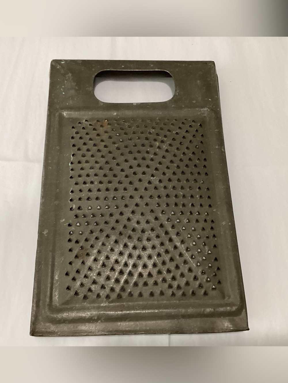 Antique Hand-punched tin-grater/shredder from the late 19th Century. It’s an